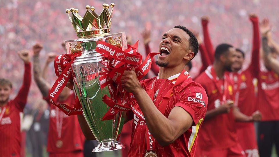 Trent Alexander-Arnold lifts the Premier League trophy